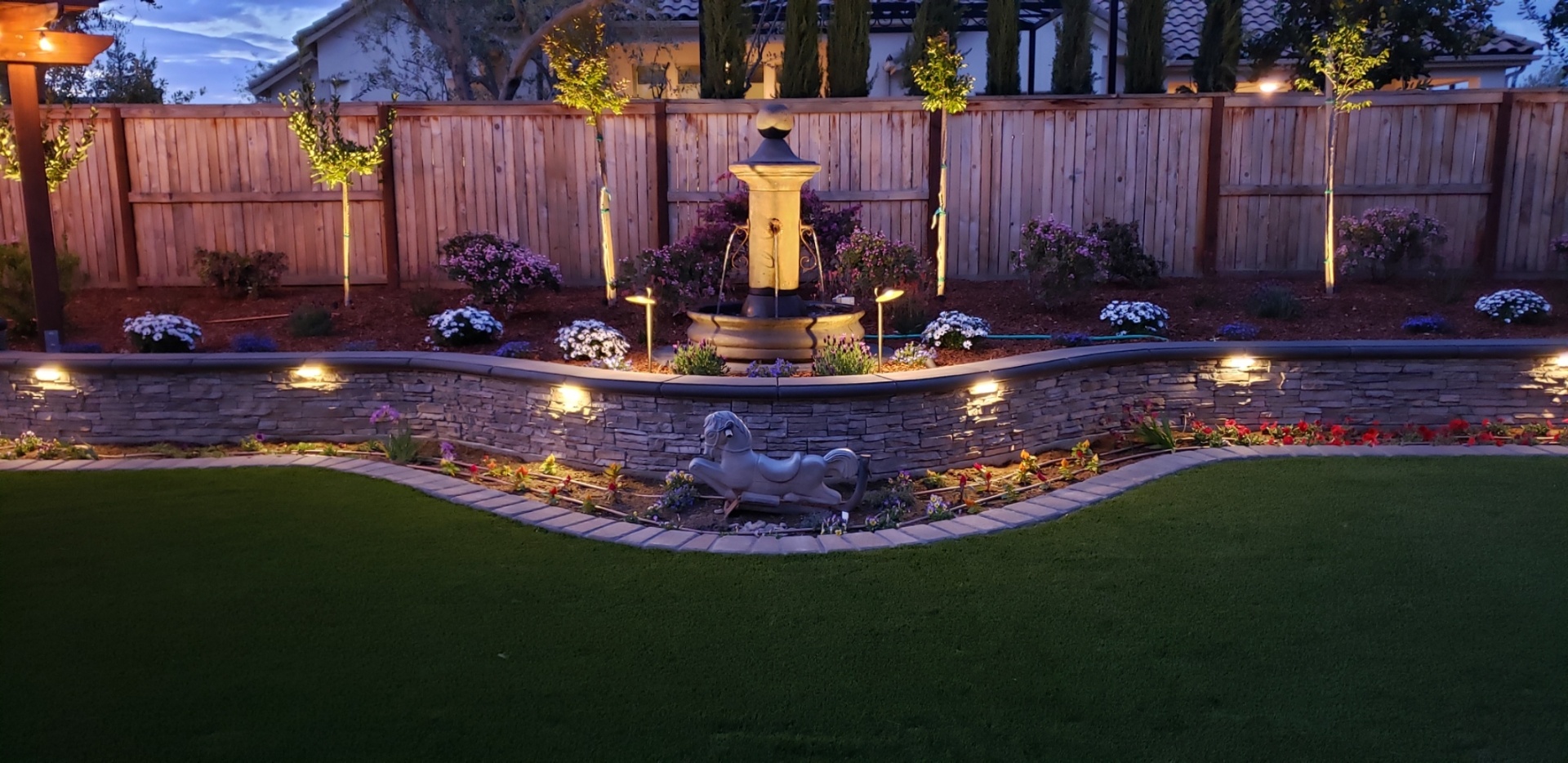 Illuminated fountain at night